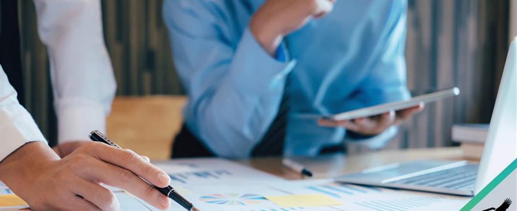 Workers going over graphs and charts