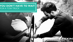 Man fixing flat tire