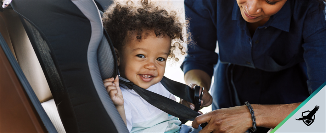 Putting young child in car seat