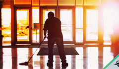 Janitor cleaning hallway