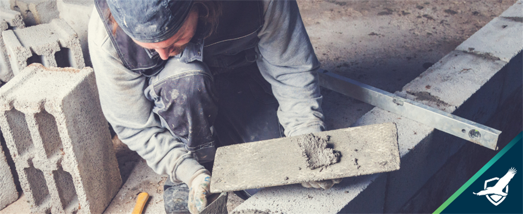 Contractor laying stone